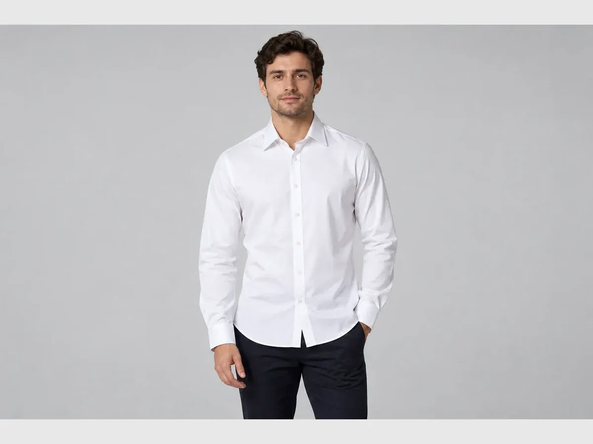 Person wearing button Down Shirt.